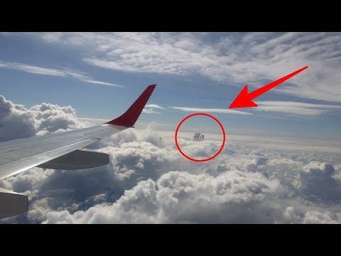 Passengers Aboard Plane Stunned as They Spot Mysterious Object, Suspected to Be a UFO, Amongst the Clouds (VIDEO) – Premium Beauty AI